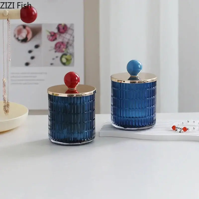 Blue ribbed glass tea canister with gold rim and red spherical lid from decorbites glass tea storage jar set