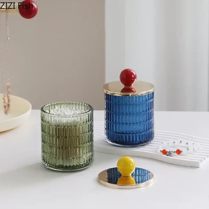 Blue ribbed glass tea canister with gold rim and red spherical lid in colorful decorbites glass tea storage jar set