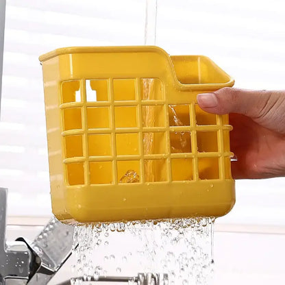 Bright yellow plastic decorbites kitchen cutlery storage holder with grid pattern and integrated handle for utensils