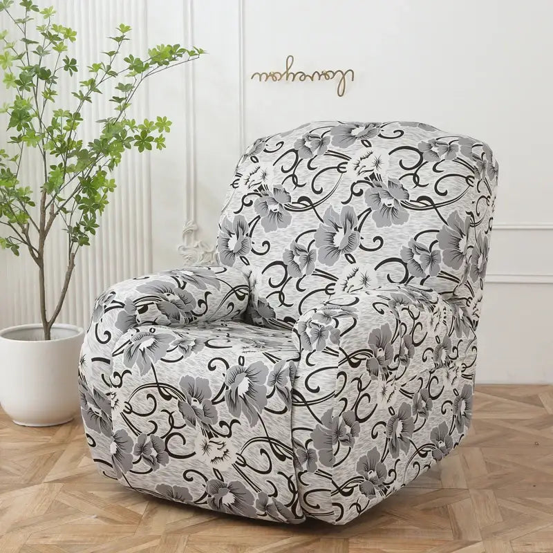 Black and gray floral-patterned stretch sofa cover snugly fits recliner with elegant blossoms on off-white base protector
