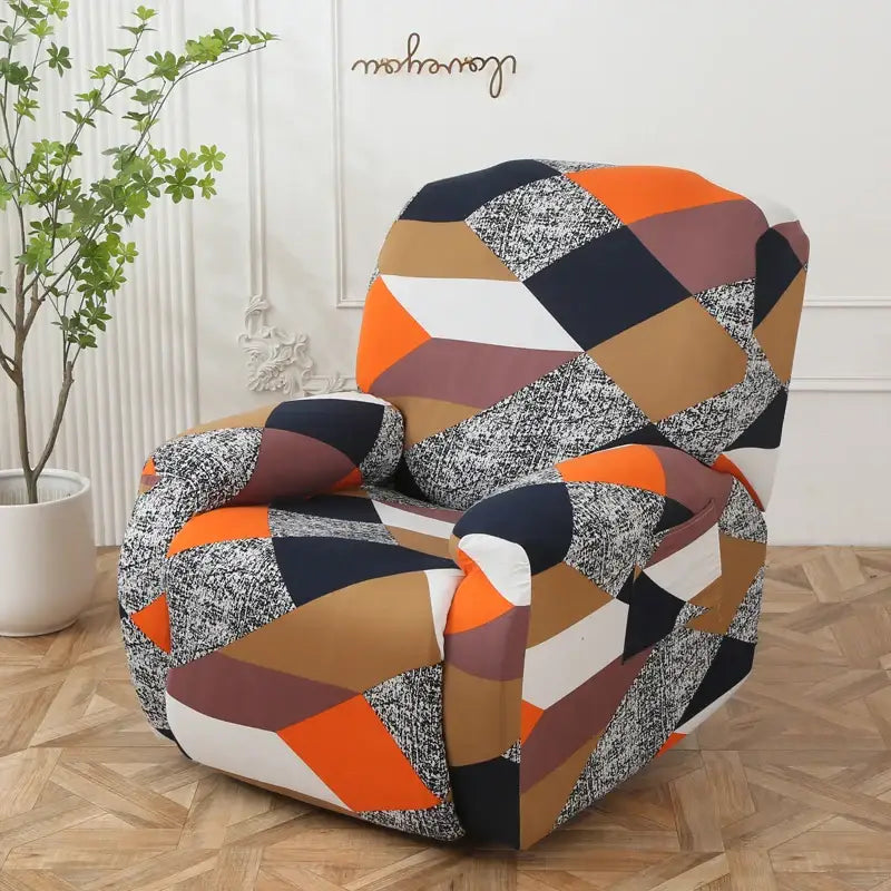 A cozy armchair with a colorful patchwork elastic sofa cover in orange, navy blue, beige, and textured gray finishing