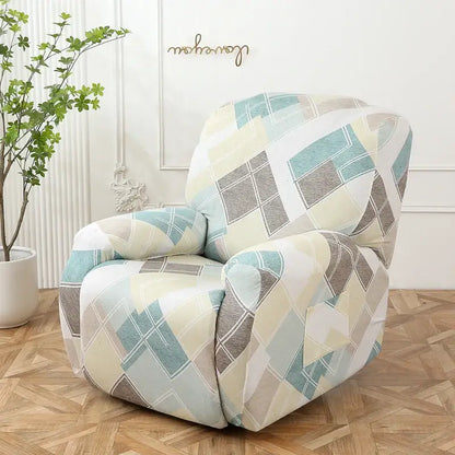 A cozy recliner chair covered with a colorful patchwork elastic sofa cover in pastel teal beige and gray tones