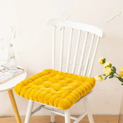 Bright yellow plush quilted cookie biscuit cushion designed for comfort and style in living room use
