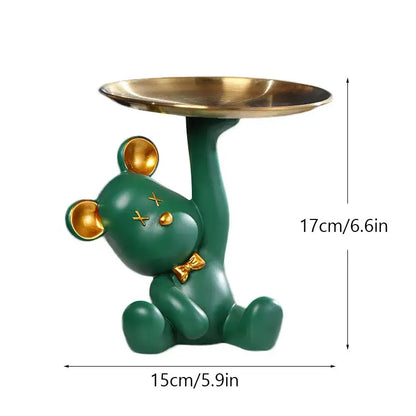 Green resin bear house entry tray keys receiver with gold accents holding brass tray for living room use