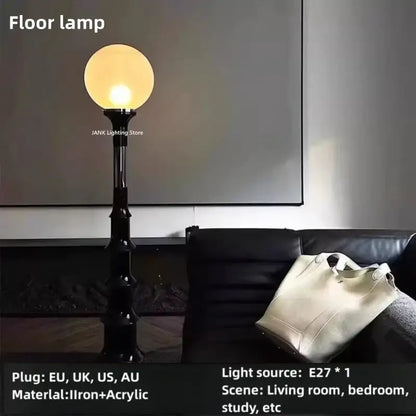 Black iron floor lamp with a spherical warm-toned acrylic globe for decorbites colorful retro led bedroom lighting