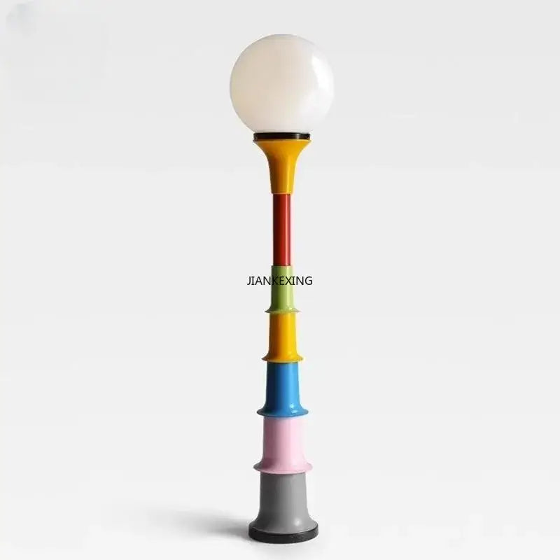 Vibrant decorbites colorful retro floor lamp with multi-colored cylindrical sections and a white glass shade for bedroom lighting