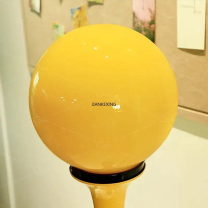 Vibrant yellow spherical glass colorful retro led floor lamp with glossy finish and black base for bedroom decorbites colorful retro
