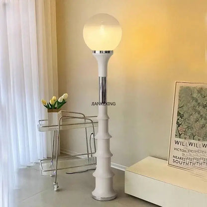 White floor lamp with spherical frosted glass globe and chrome accents for decorbites colorful retro led lighting