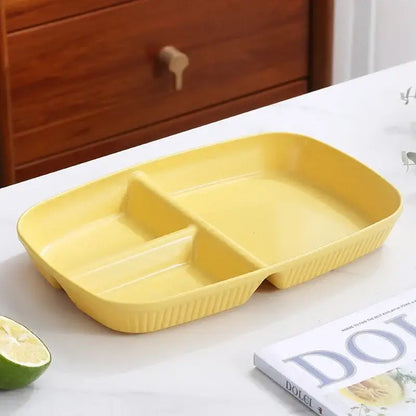 Bright yellow rectangular divided dish diet plate with three compartments and ribbed edges for dining room use