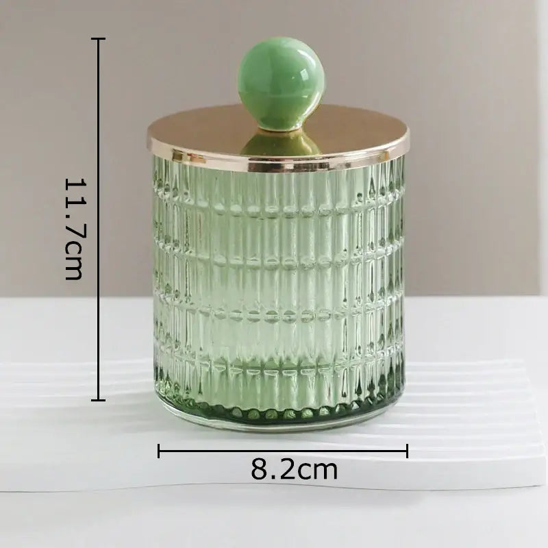 A translucent green ribbed glass tea canister with gold lid and jade knob for storage jar by decorbites glass tea