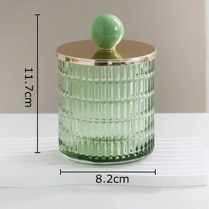 A translucent green ribbed glass tea canister with gold lid and jade knob for storage jar by decorbites glass tea