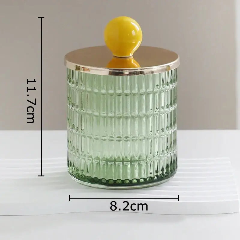 Translucent green decorbites glass tea storage jar with vertical ridges gold lid and yellow knob for kitchen storage