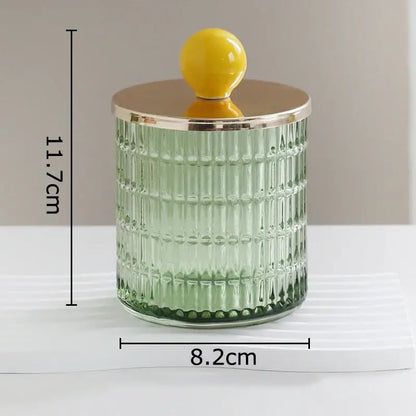 Translucent green decorbites glass tea storage jar with vertical ridges gold lid and yellow knob for kitchen storage