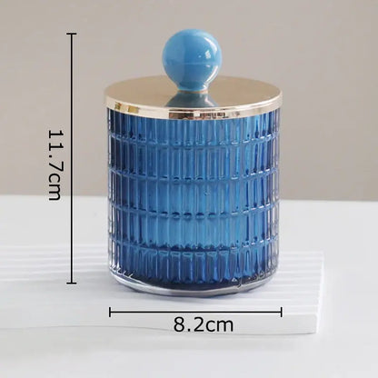 A blue ribbed glass tea canister with gold rim and lid from decorbites glass tea storage jar set