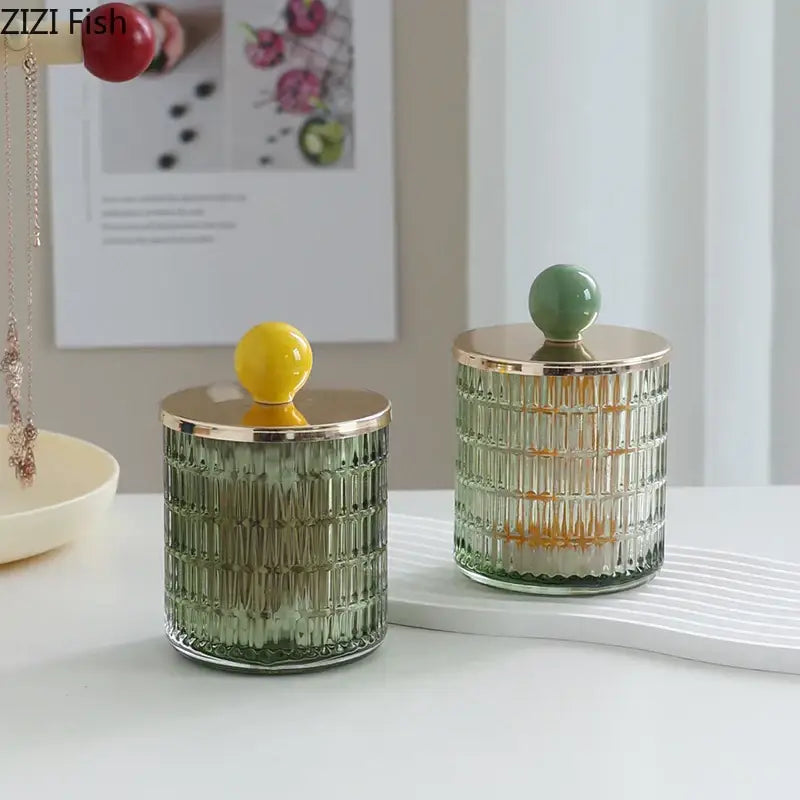 Two elegant green ribbed glass tea canisters with gold rims and colorful ceramic knobs storage jar decorbites glass tea