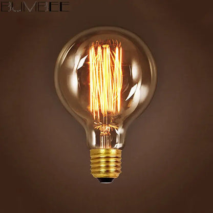 A warm vintage-style incandescent bulb with clear glass and brass base in a decorbites colorful silicone pendant light