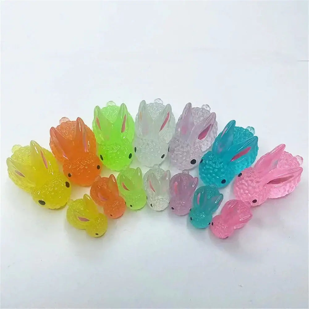 A collection of colorful translucent micro rabbit figurines in various hues for bedroom decor ornaments