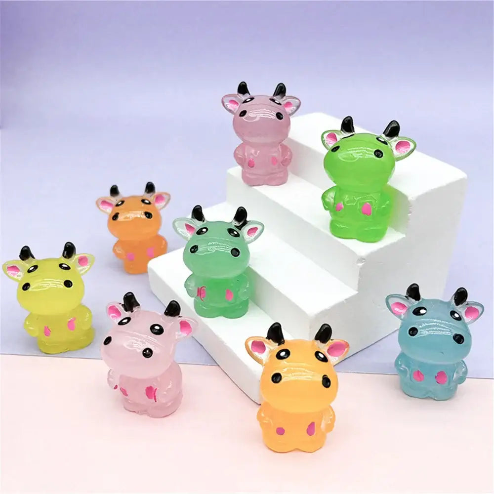 Colorful translucent plastic cow figurines with black horns and pink inner ears for rabbit figurine bedroom decor