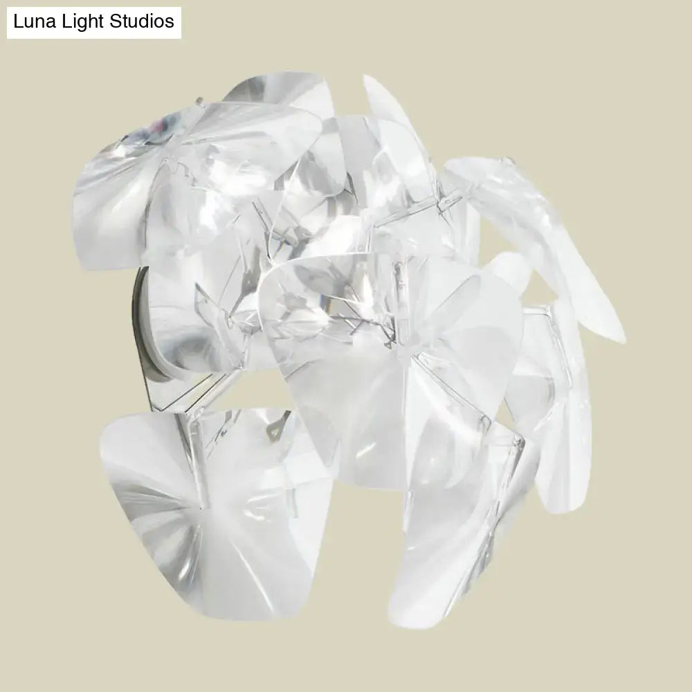 Contemporary acrylic single sconce light fixture with clear translucent flower-shaped layered pendant for dining room