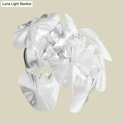 Contemporary acrylic single sconce light fixture with clear translucent flower-shaped layered pendant for dining room