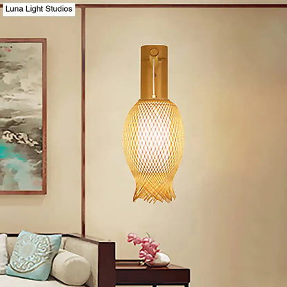 Contemporary bamboo golden wall light fixture with woven pendant design and warm glowing illumination for bedroom use