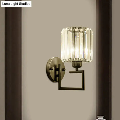 Contemporary black and brass crystal sconce with brushed brass base and faceted crystal shade 110v-120v bedroom light