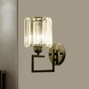 Contemporary black and brass crystal sconce with a brushed brass base and square arm 110v-120v bedroom light