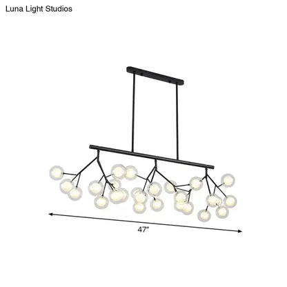 Black metal chandelier with frosted glass globe lights in a branching design for bubbles island lighting and island lighting