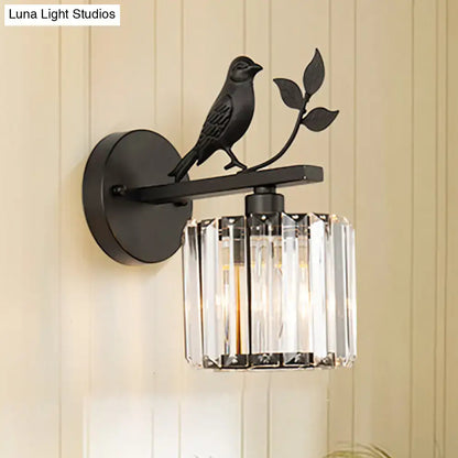 Contemporary black wrought iron wall lamp with bird leaf design and cylindrical crystal shade compatible with e12 e14 light type