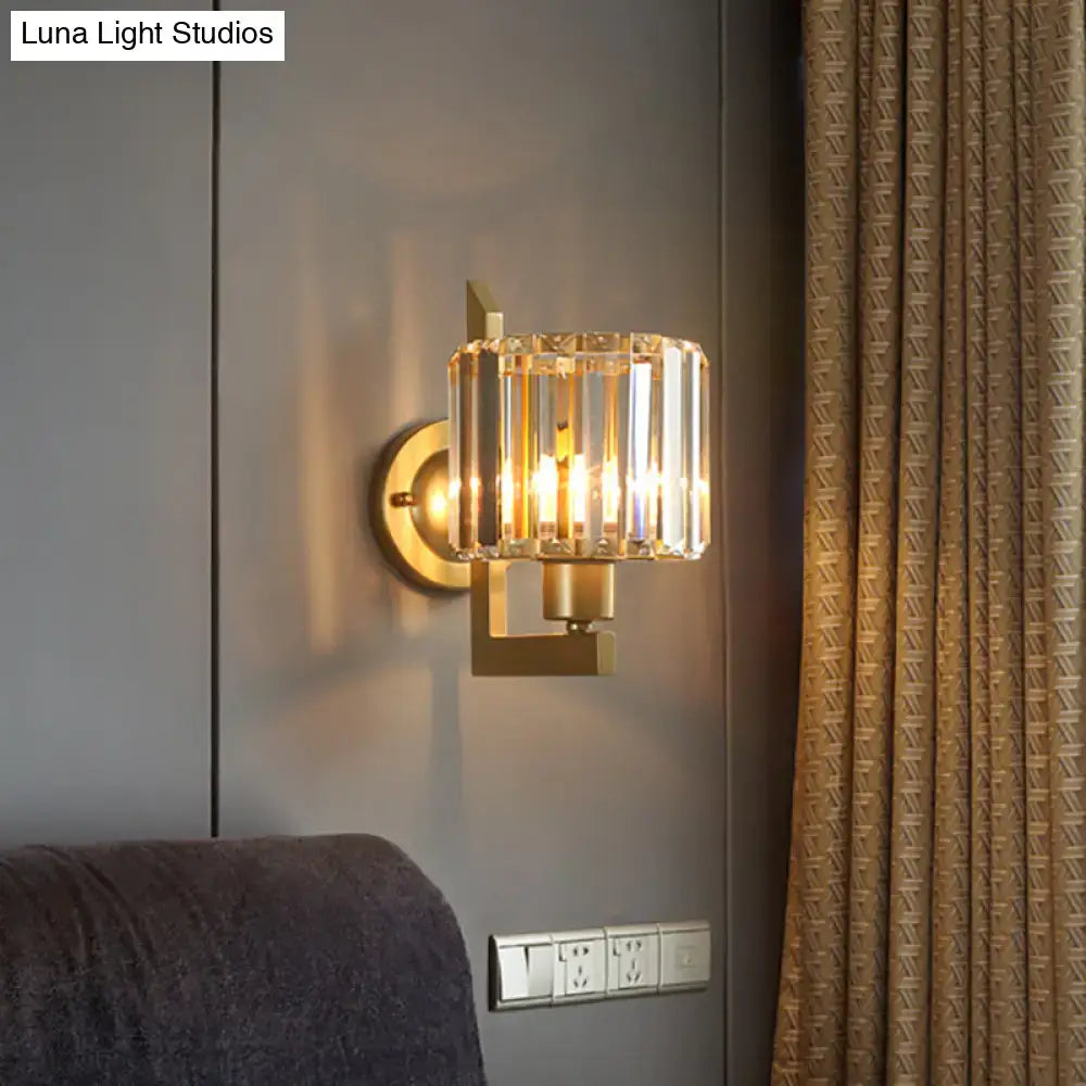 Contemporary black gold crystal drum wall lamp featuring gold-toned sconce with cylindrical faceted crystal shade e26 e27