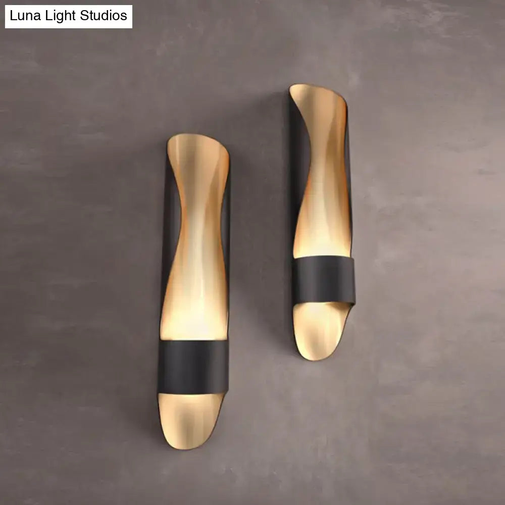 Contemporary black and gold twisted led wall sconce with sleek curved design for modern bedroom lighting