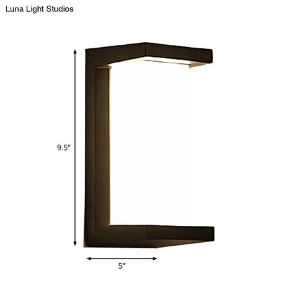 Contemporary dark bronze wall lamp with rectangular angular frame and frosted glass panel for outdoor use