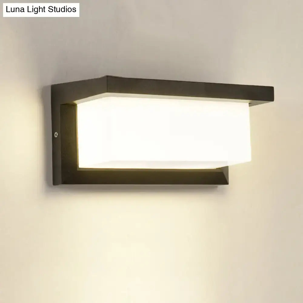 Contemporary black led wall lamp with rectangular frosted glass diffuser emitting warm white light flush mounted