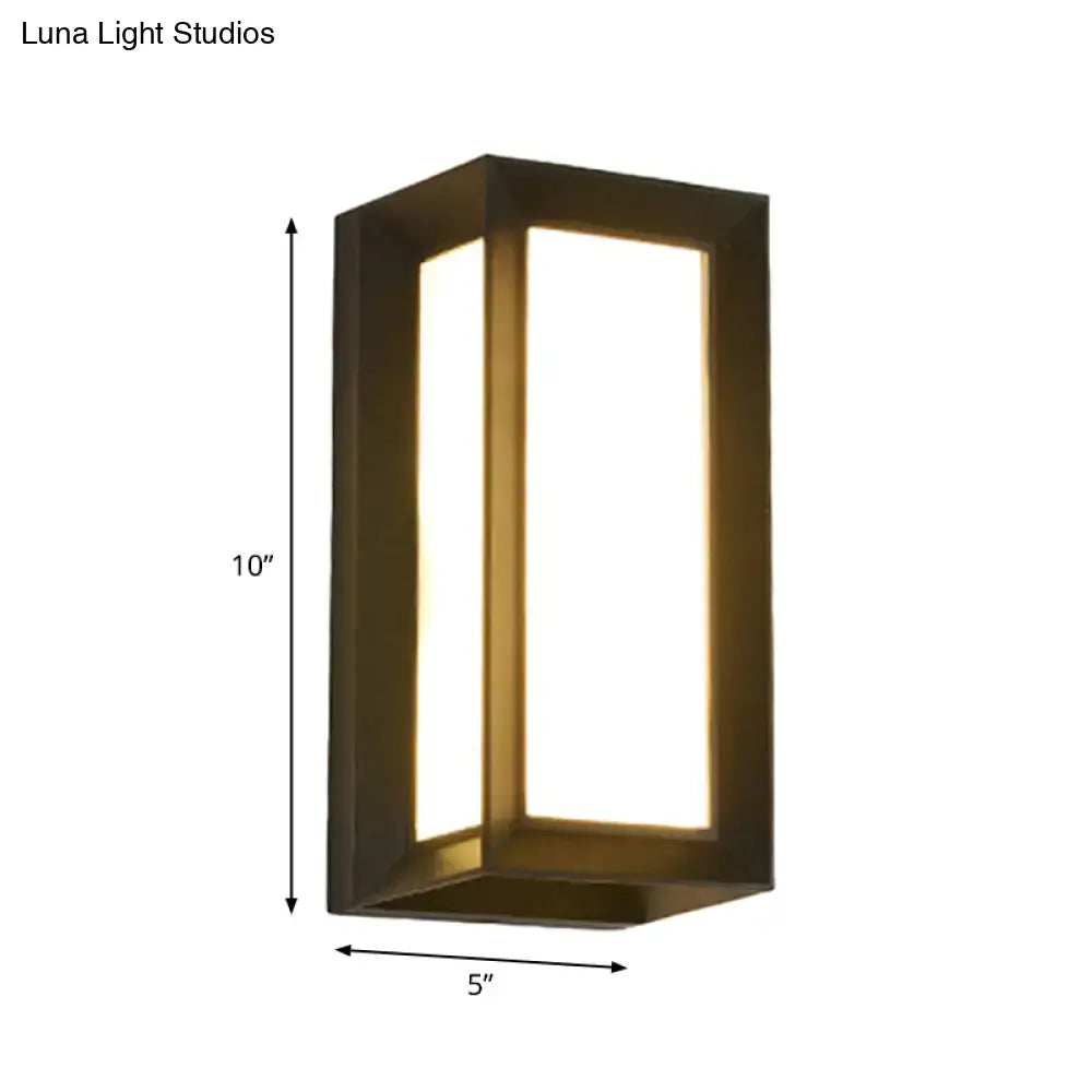 A sleek rectangular dark bronze wall lamp with warm LED lighting for contemporary outdoor courtyard settings