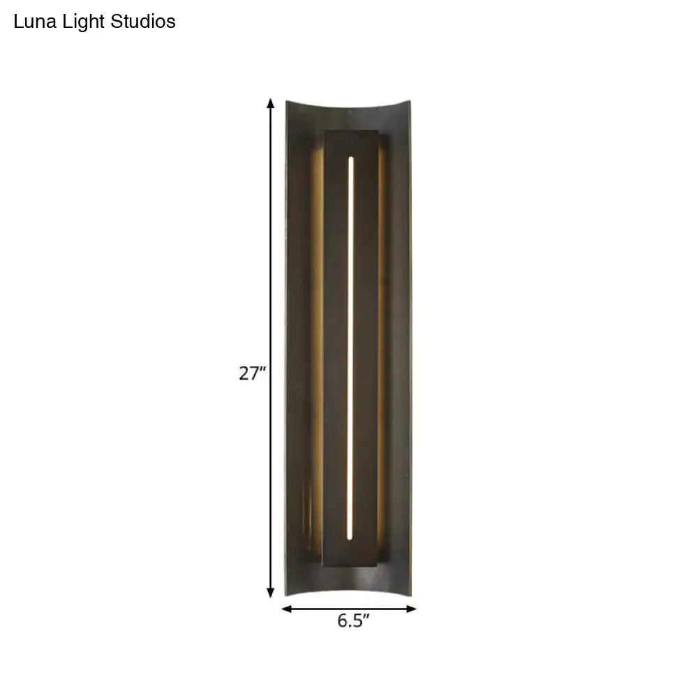 Contemporary black led wall lamp with metal shade featuring a sleek dark bronze finish and illuminated vertical slit design