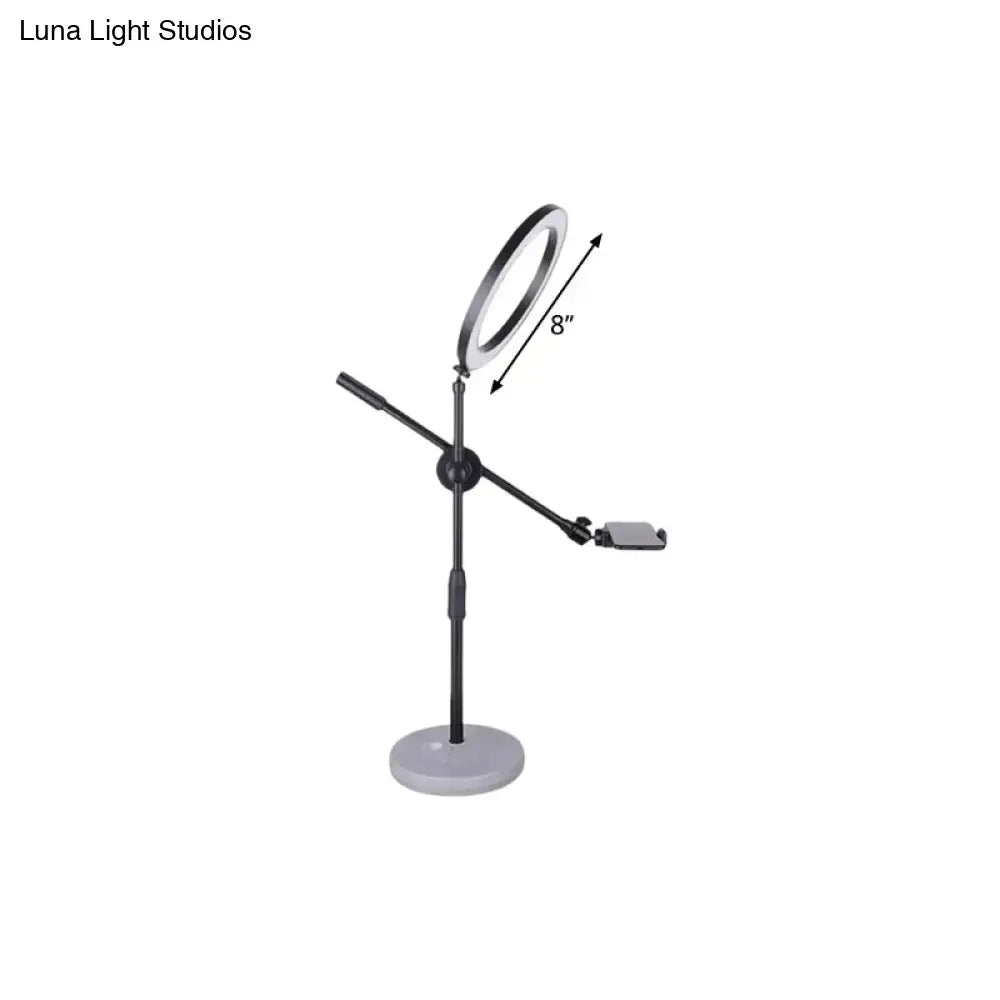 Contemporary black round shaped metal vanity light with adjustable stand and phone mount compatible with 110v-120v 220v-240v