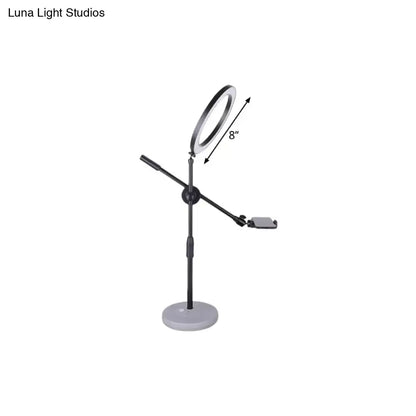 Contemporary black round shaped metal vanity light with adjustable stand and phone mount compatible with 110v-120v 220v-240v