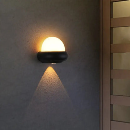 Contemporary black semi-sphere wall sconce outdoor area light with warm diffused glow for patio wall lamp use