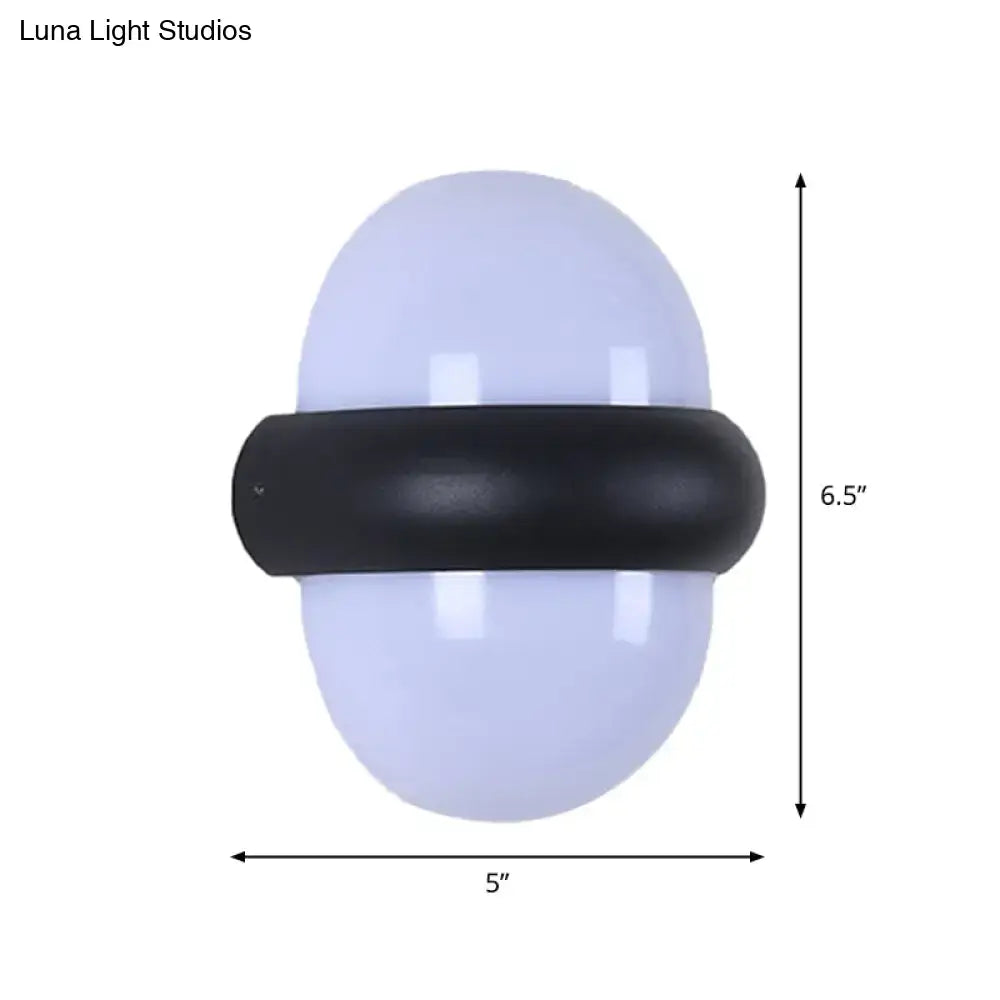 Contemporary black wall sconce with frosted white oval glass and matte band, ideal for outdoor area wall lamp use