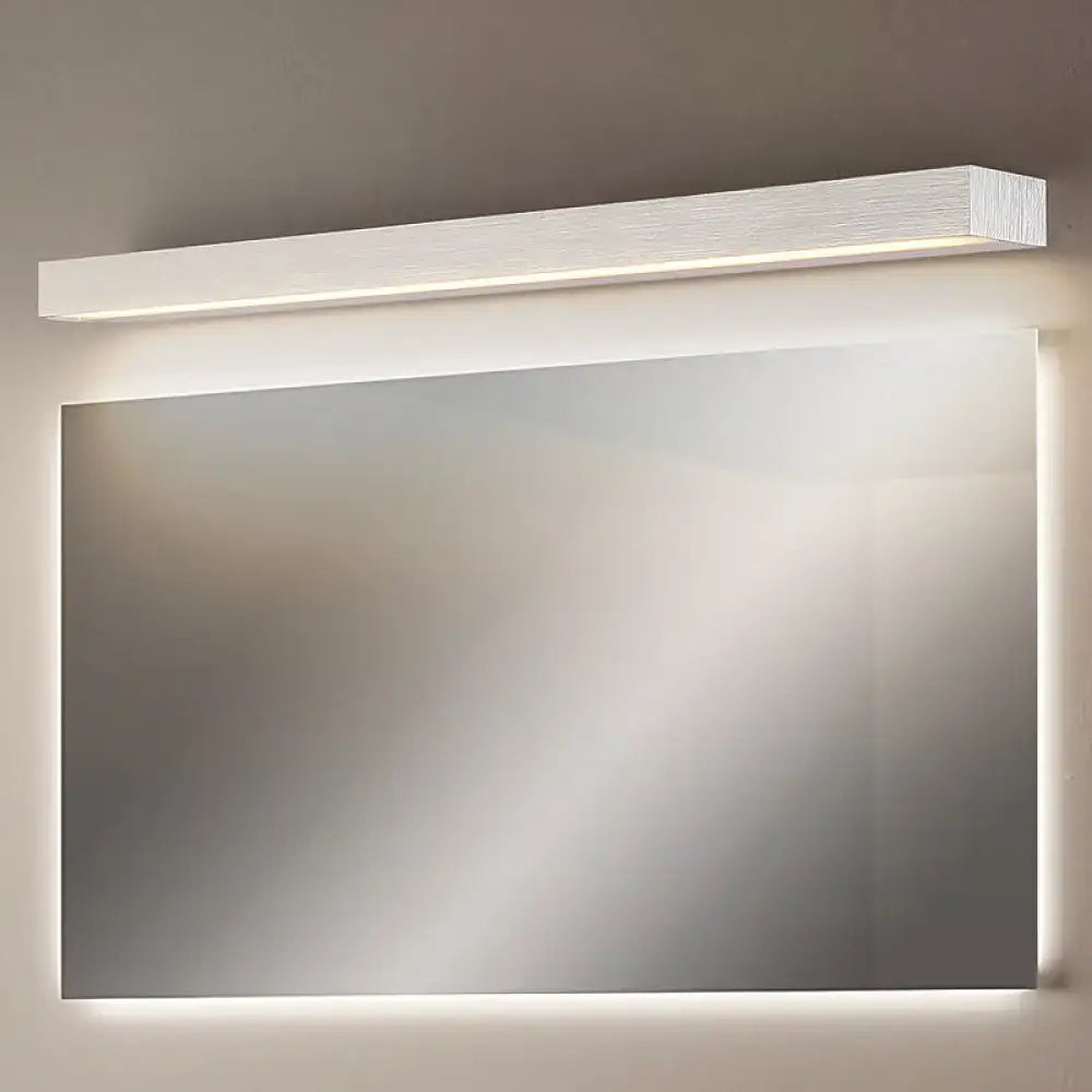 Modern white wooden-textured linear vanity sconce led light fixture with white warm illumination mounted above mirror