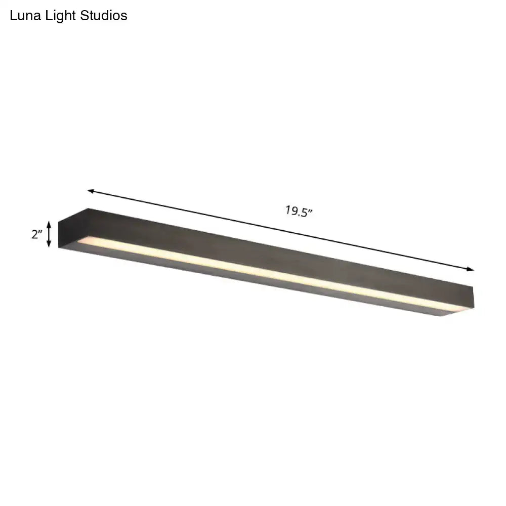 Modern matte black and silver linear vanity sconce with warm white illumination and minimalist LED bathroom lighting design