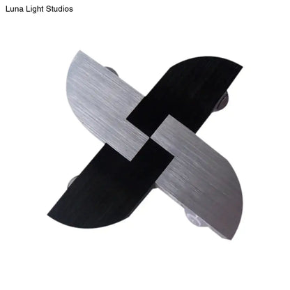 Contemporary black and silver metallic cross shaped wall sconce with brushed finish for living room lighting