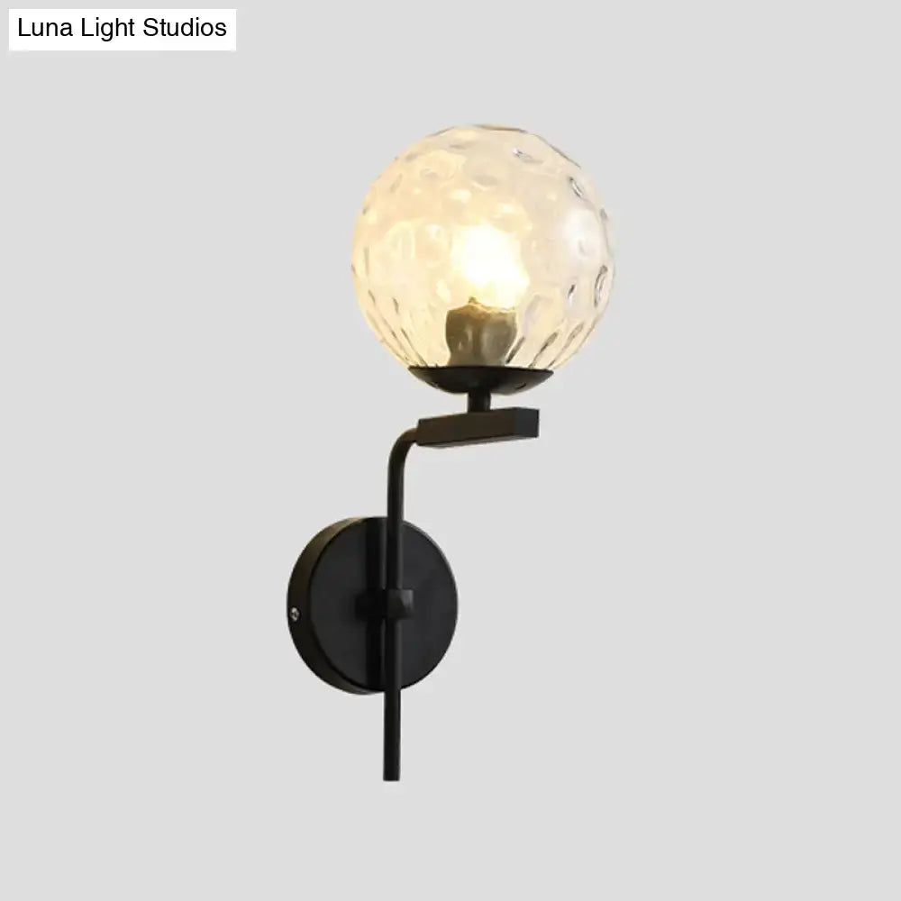 Contemporary black metal wall mount lighting with textured translucent glass globe for bedroom wall mount use