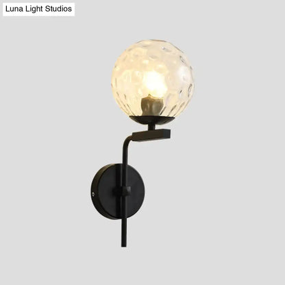 Contemporary black metal wall mount lighting with textured translucent glass globe for bedroom wall mount use