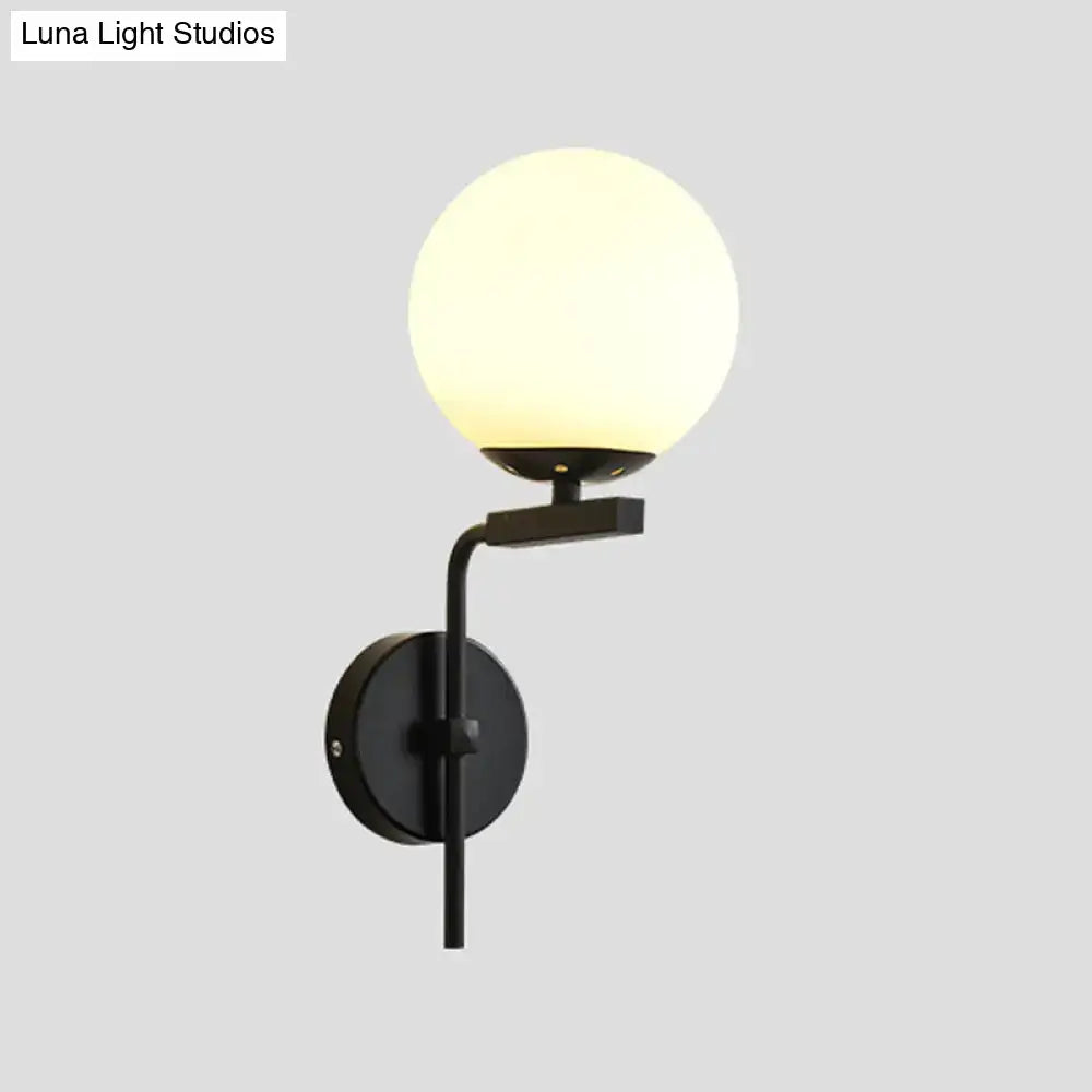 Contemporary black metal wall mount lighting with frosted glass globe for bedroom wall mount sconce