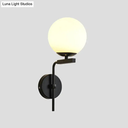 Contemporary black metal wall mount lighting with frosted glass globe for bedroom wall mount sconce