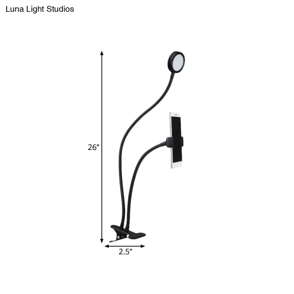 Contemporary black flexible led desk lamp with adjustable clamp and phone holder for bedroom use