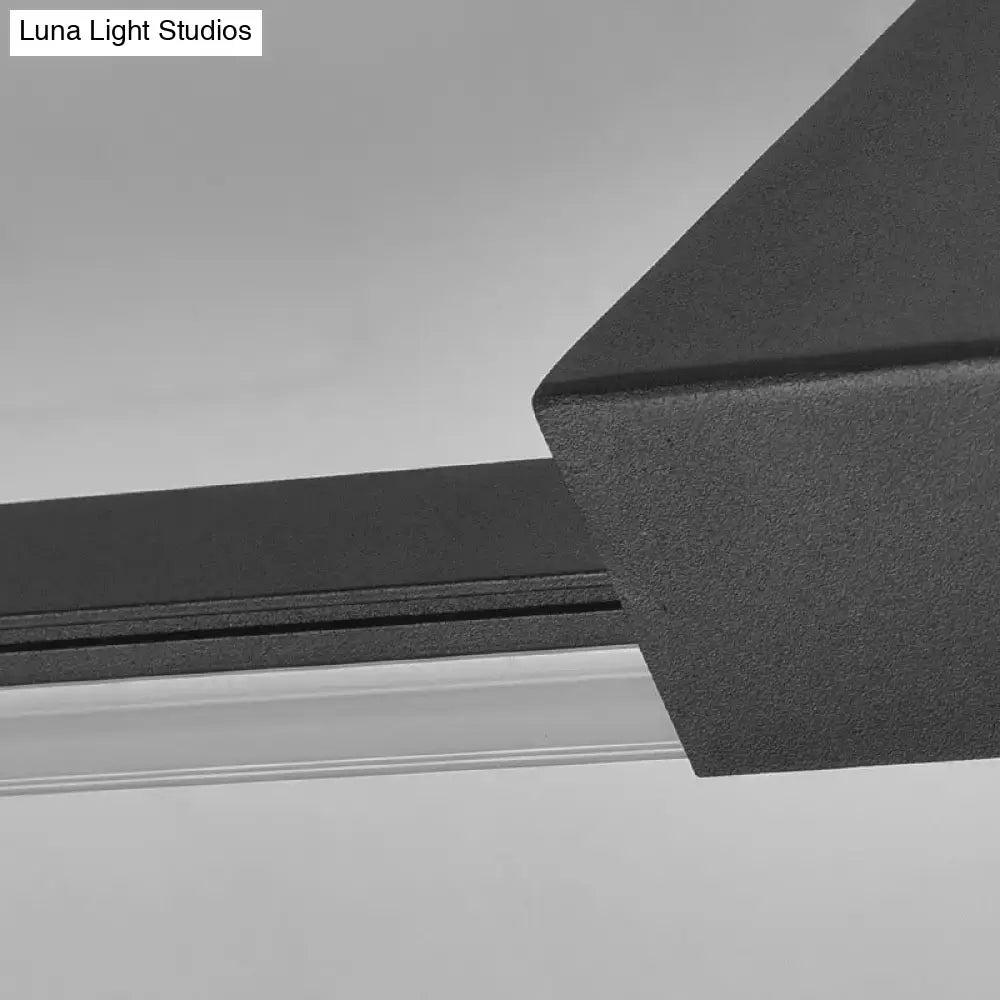 Contemporary black matte metal wall light fixture with sleek angular design and adjustable fixture width for bathroom use