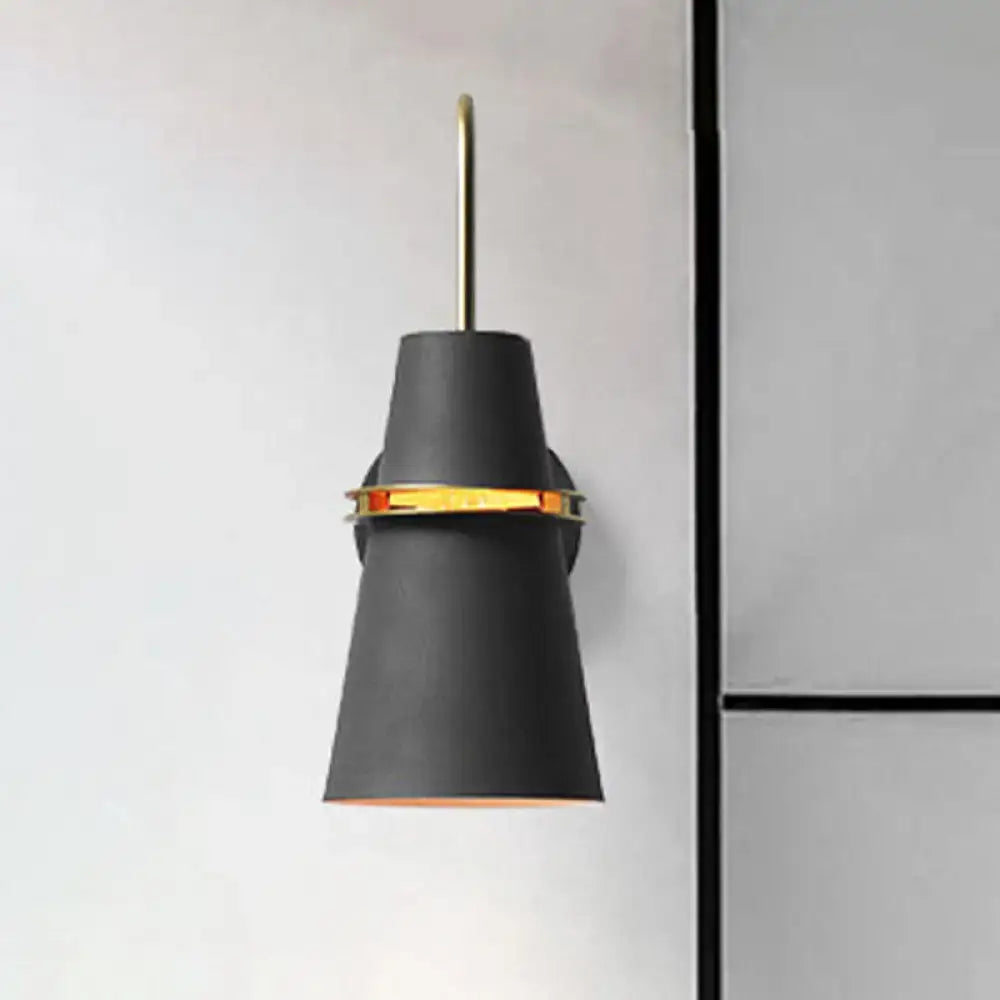 Contemporary blue and gold wall sconce light with black conical shade, gold accent band, and slender brass stem for bedroom