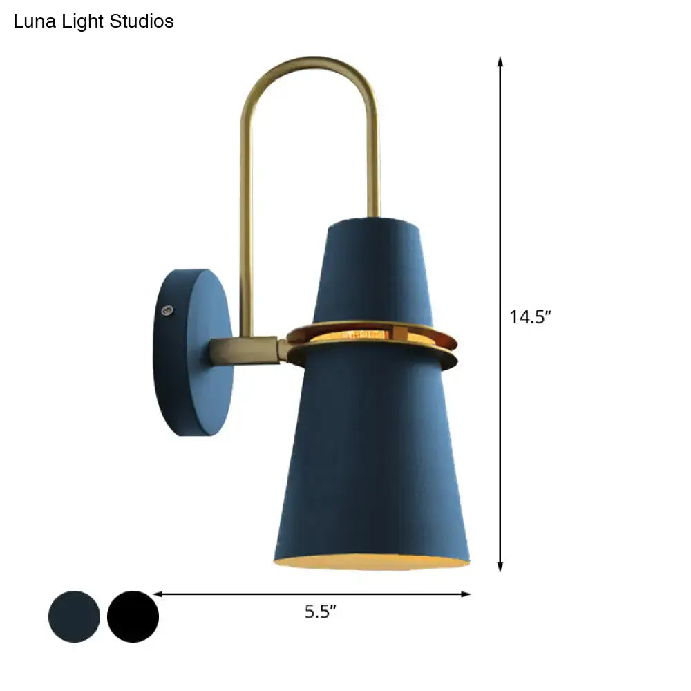 Contemporary blue and gold flared wall sconce light with brass accents and gold-lined interior for bedroom use